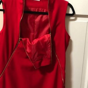 Red dress with gold zip.